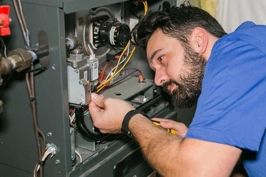 technician-working-on-furnace