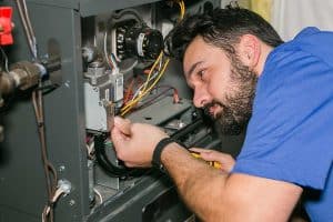 technician-working-on-furnace