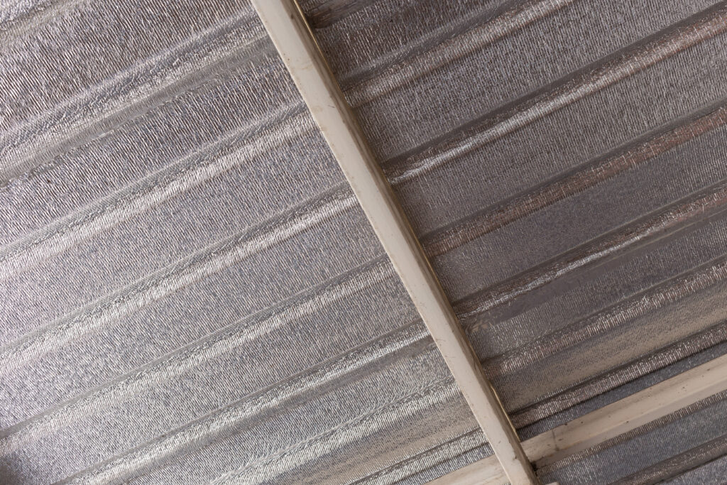 Radiant barrier installed on the ceiling of a roof.